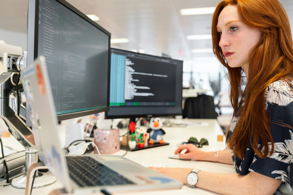 woman working at desktop computer in office